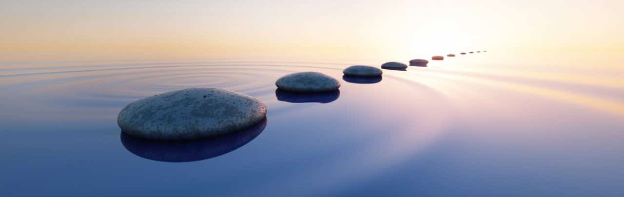 A series of stepping stones in smooth water