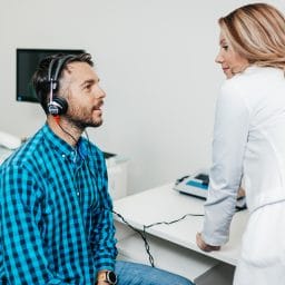 Man gets a hearing test.