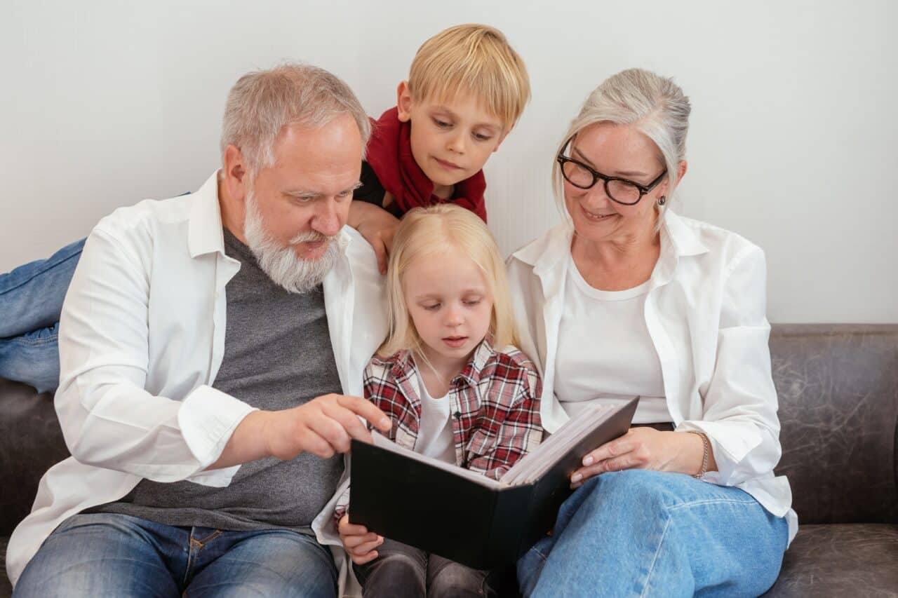 Grandparents reading a story with their grandchildren.